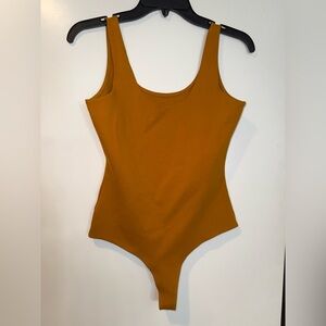 Shinestar Burnt Yellow Bodysuit One Piece